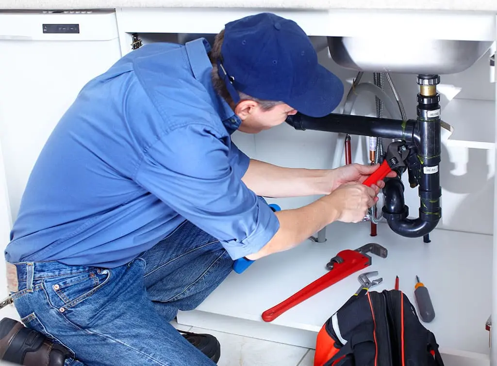 plumber-using-wrench